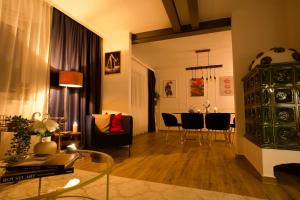 a living room with a couch and a table at RK Private Residence in Trautmannsdorf an der Leitha