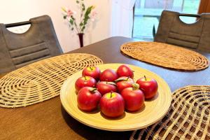 a plate of red apples on a wooden table at Landlust in Lübbenau +27 photos