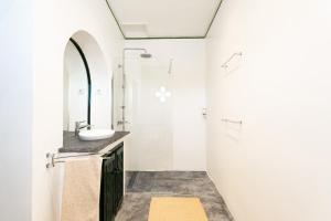a bathroom with a sink and a shower at Eighteen21 Houses - Casa dos Condes in Cano +65 photos