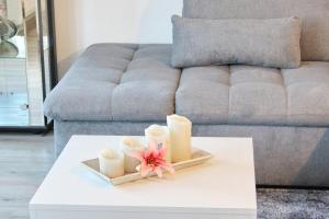 a living room with a table with candles on it at Spreemitte in Lübbenau
