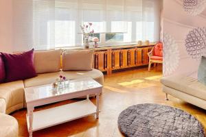 a living room with a couch and a table at Wildbiene in Lübbenau +27 photos