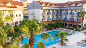 an aerial view of the resort with a swimming pool and palm trees at Silver Hotel in Side