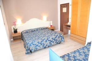 Postel nebo postele na pokoji v ubytování Hotel Moderno + 15 fotografií