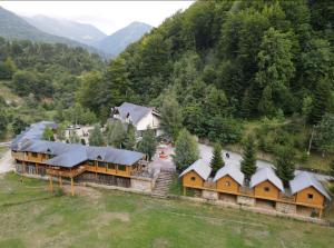 an aerial view of a house in the mountains at Hotel Gryka in Peje