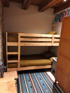 a bedroom with two bunk beds in a room at Equisoain Ala Sur in Monreal