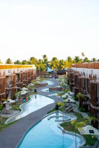 an aerial view of a resort with two pools at Studio River 101 in Pôrto de Pedras