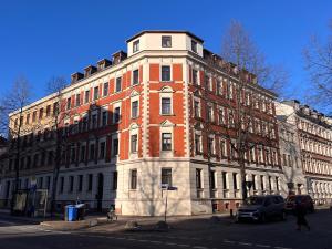 a large brick building on the corner of a street at FirstClass 2R_Apartment in Leipzig in Leipzig