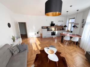 a living room with a couch and a table at FirstClass 2R_Apartment in Leipzig in Leipzig