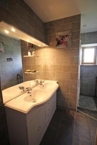 a bathroom with a sink and a mirror at La chaudière in Saint-Auvent +35 photos