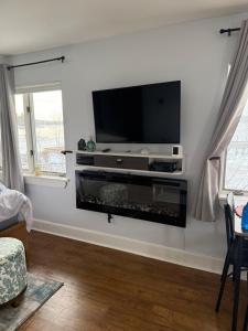 a living room with a flat screen tv on a wall at Pet friendly waterfront condo in Edgecomb