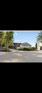 a picture of a street with houses and a tree at Pet friendly waterfront condo in Edgecomb