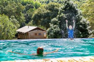 two children playing in a swimming pool at AfriCamps at Mackers 