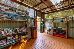 a book store with books on shelves in a building at AfriCamps at Mackers 