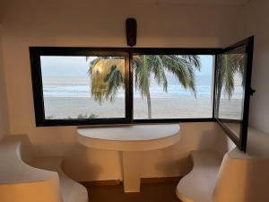 a window with a view of the beach at Kalao beach in Cap Skirring