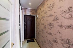 a hallway with drawings on the walls at Apartment-Lawina in Sumy