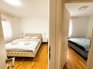 a bedroom with two beds in a room at Apartman Sučić in Livno