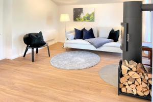 a living room with a couch and a fireplace at Lokoschen in Lübbenau