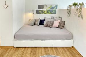 a bed in a room with a white bed frame at Admiral in Lübbenau