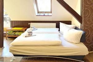 a bedroom with two beds and a window at An der Postmeilensäule in Lübbenau