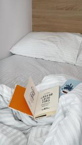 two books sitting on top of a bed at Molfar blue in Yasinya