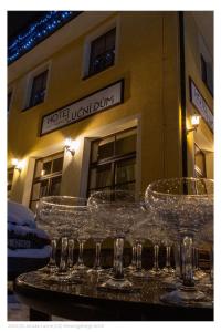 a group of wine glasses sitting on a table at Lucni Dum in Janske Lazne