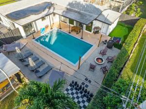an overhead view of a swimming pool in a backyard at Hollywood Heated Pool Mini Golf Unique VR Room in Hollywood