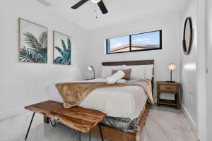a bedroom with a bed and a ceiling fan at Hollywood Heated Pool Mini Golf Unique VR Room in Hollywood