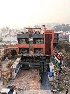 a building with a sign that reads apprentice food junction at Evesta Micasa in Haridwār