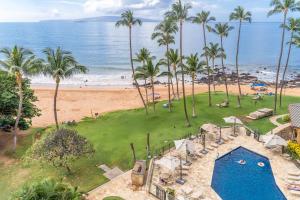 an aerial view of a resort with a swimming pool and a beach at Mana Kai 611C in Wailea