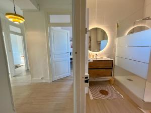 a bathroom with a sink and a mirror at Chez MARIE in Valence +32 photos