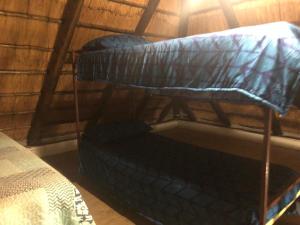 two bunk beds and a bed in a room at Best view family loft in Oranjeville