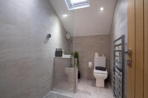a bathroom with a toilet and a sink at The Old Pitman's house in Ollerton +27 photos