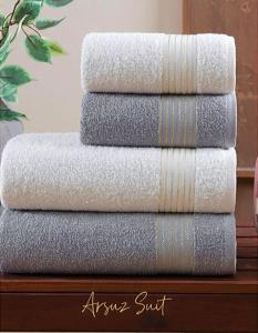 a stack of towels sitting on top of a table at Arsuz Suit in Hatay
