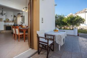 a dining room with a table and chairs at Christine Beachside Villa Pefkos in Pefki