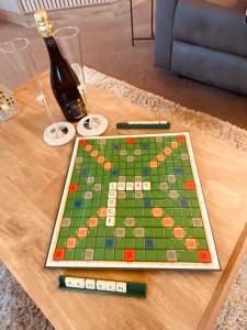 a chess board on a table on a coffee table at Looby Lodge in Tattershall +42 photos