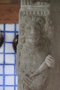 a stone statue of a person holding a baseball bat at Le relais de saint Jacques in Boulogne-sur-Mer