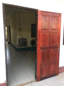 an open door to a room with a television at Yada House in Nong Ki +6 photos