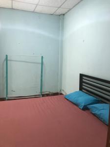 a room with a bed and a glass door at Yada House in Nong Ki