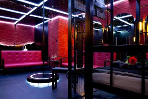 a room with two bunk beds and a couch at Love Apartament z sauną i jacuzzi in Katowice