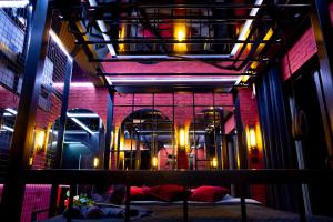 a room with a bed in a building with lights at Love Apartament z sauną i jacuzzi in Katowice