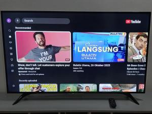 a television screen with a bunch of movies on it at Homestay Makyu Kuala Kangsar in Kuala Kangsar
