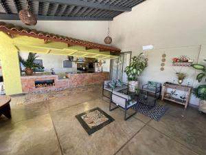 a living room with a fireplace and a couch at Pousada Real in Caldas Novas