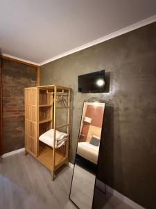 a room with a bunk bed and a mirror at Casa Do Campo in Peniche
