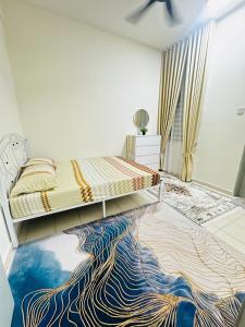 a bedroom with a bed with a rug on the floor at Voila PD Homestay in Lukut