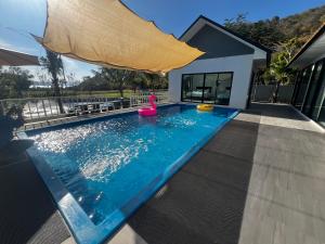 a swimming pool with a pink toy in a house at The Forest Pool villa & cafe in Ban Wang Yao