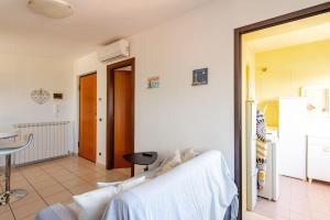 a living room with a couch and a table at Lovely Flat with See View in Roseto degli Abruzzi