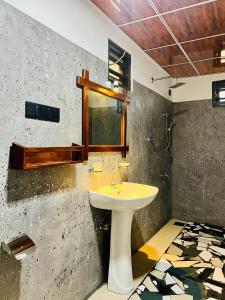 a bathroom with a sink and a window at Sea Paradise Hidden Villa in Tangalle