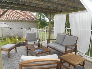 a patio with two chairs and a table at Gîte du Clos de Gamel in Lascabanes