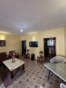 a living room with a couch and a table at Golf BnB in Nyahururu