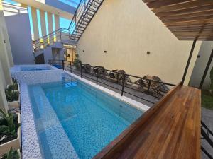 a swimming pool in the middle of a building at La Finca hotel in Cruz del Eje